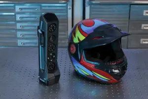 A colorful full-face helmet with a dark visor sits on a perforated metal workbench beside a tall black speaker, with blue tool chests in the background.